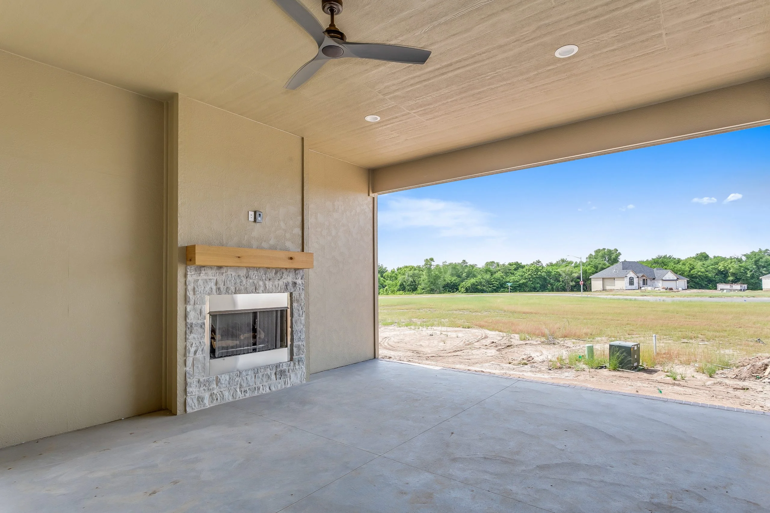 Covered patio with fireplace off the main living area