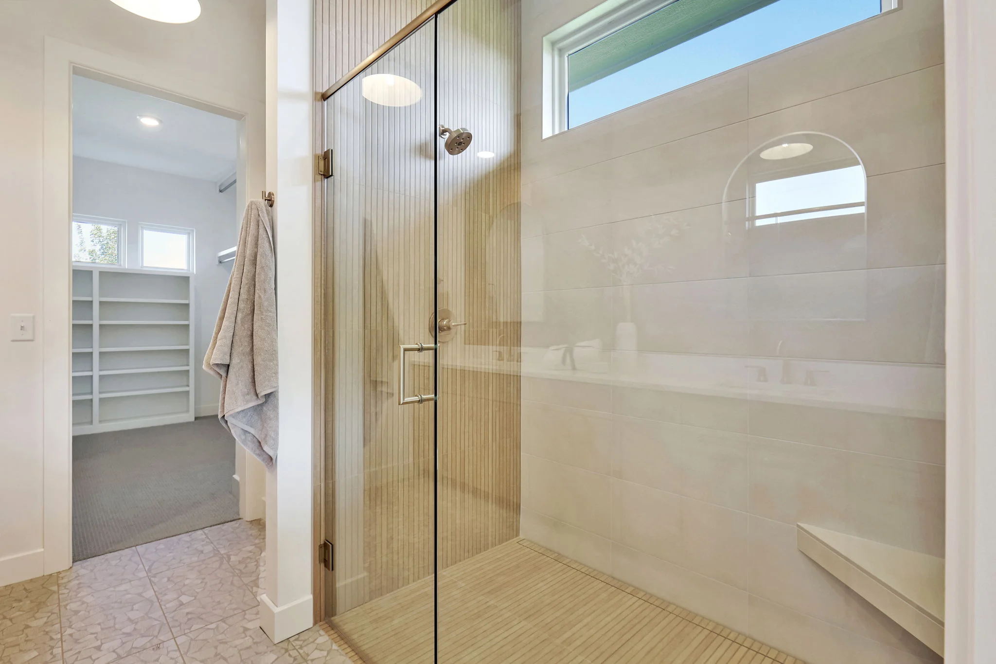 Zero-entry glass shower in a primary bath