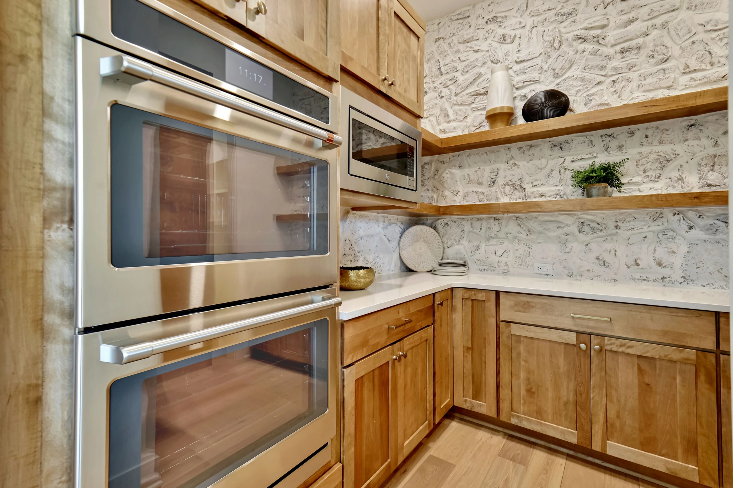 Kitchen with double wall ovens and custom cabinetry
