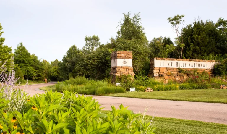The stone entrance monument at Flint Hills National in Andover, Kansas