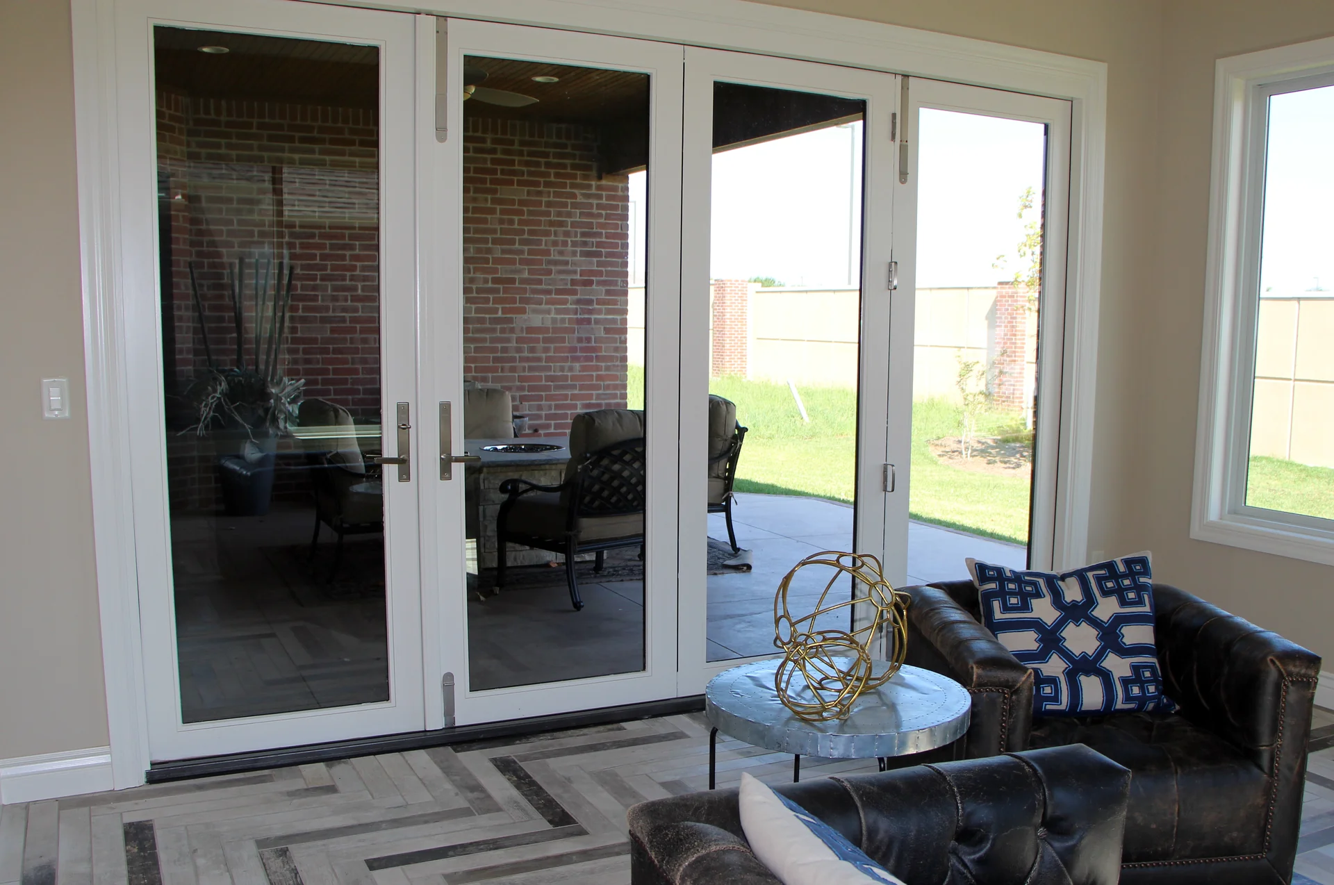 French doors opening from the living room to a covered patio in a Sharp patio home