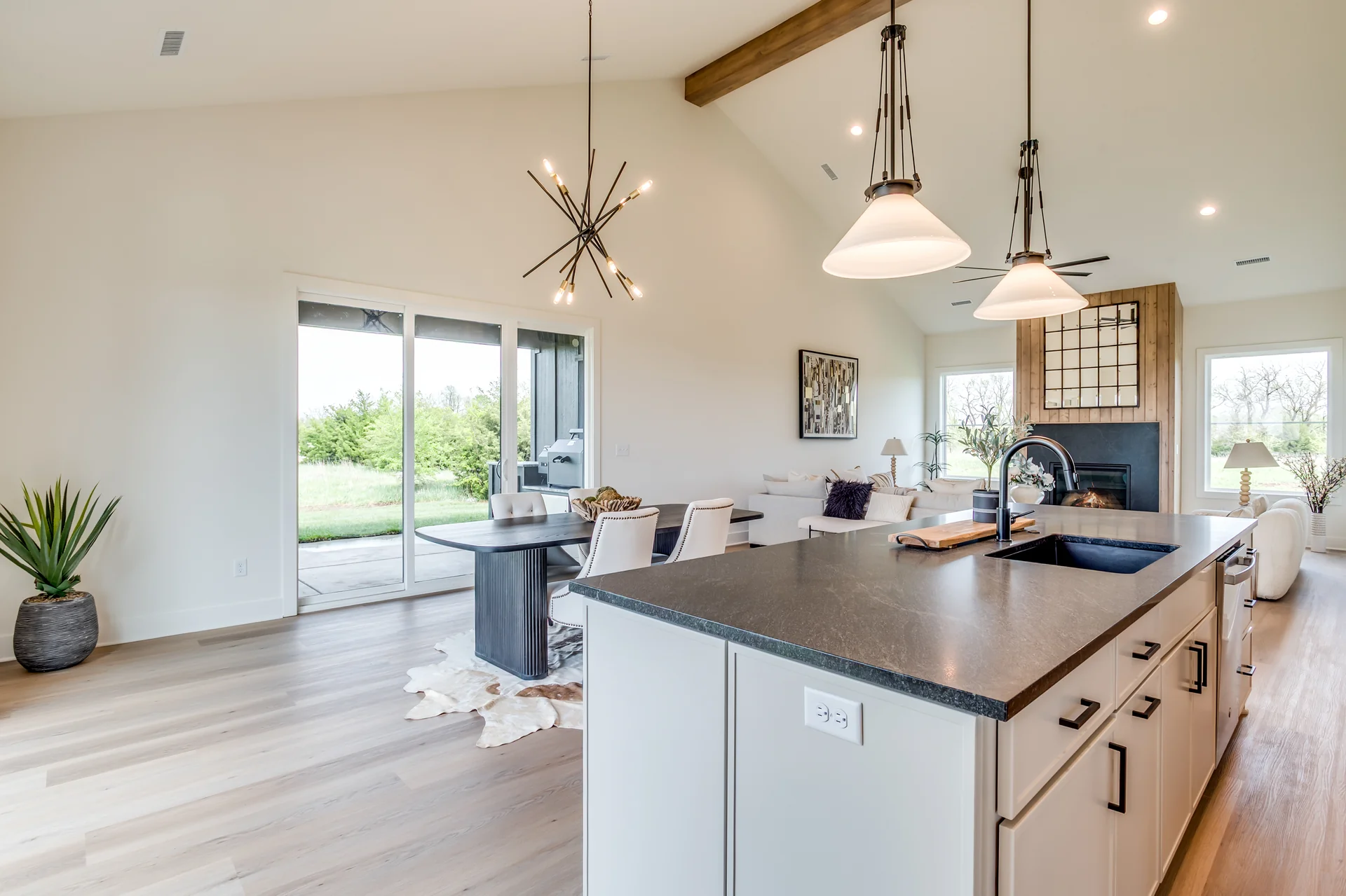 Open kitchen and great room under a vaulted ceiling, all on one level